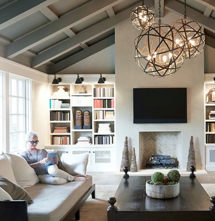 woman is sitting at sofa in the luxury living room